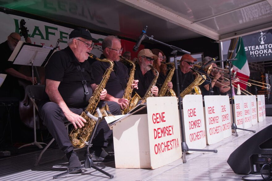 At noon Monday, the Gene Dempsey Orchestra will perform, this year in honor of its founder Gene “Dempsey” Passarella, who died recently at 100 years old.