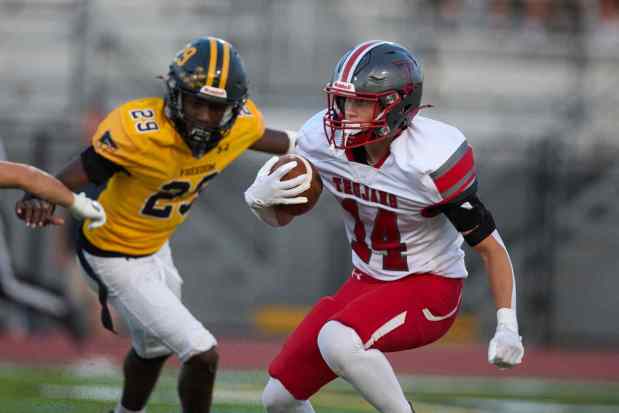 Parkland's Justin Barnes returns the opening kickoff against Freedom on Friday, Sept. 4, 2026, at Bethlehem School District Stadium. (David Garrett/Special to The Morning Call)