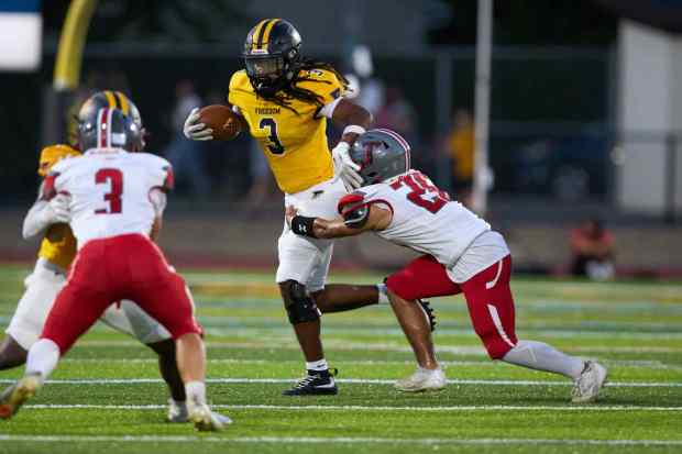 Freedom's Lashawn Johnson breaks several tackles on Friday, Sept. 4, 2026, at Bethlehem School District Stadium. (David Garrett/Special to The Morning Call)