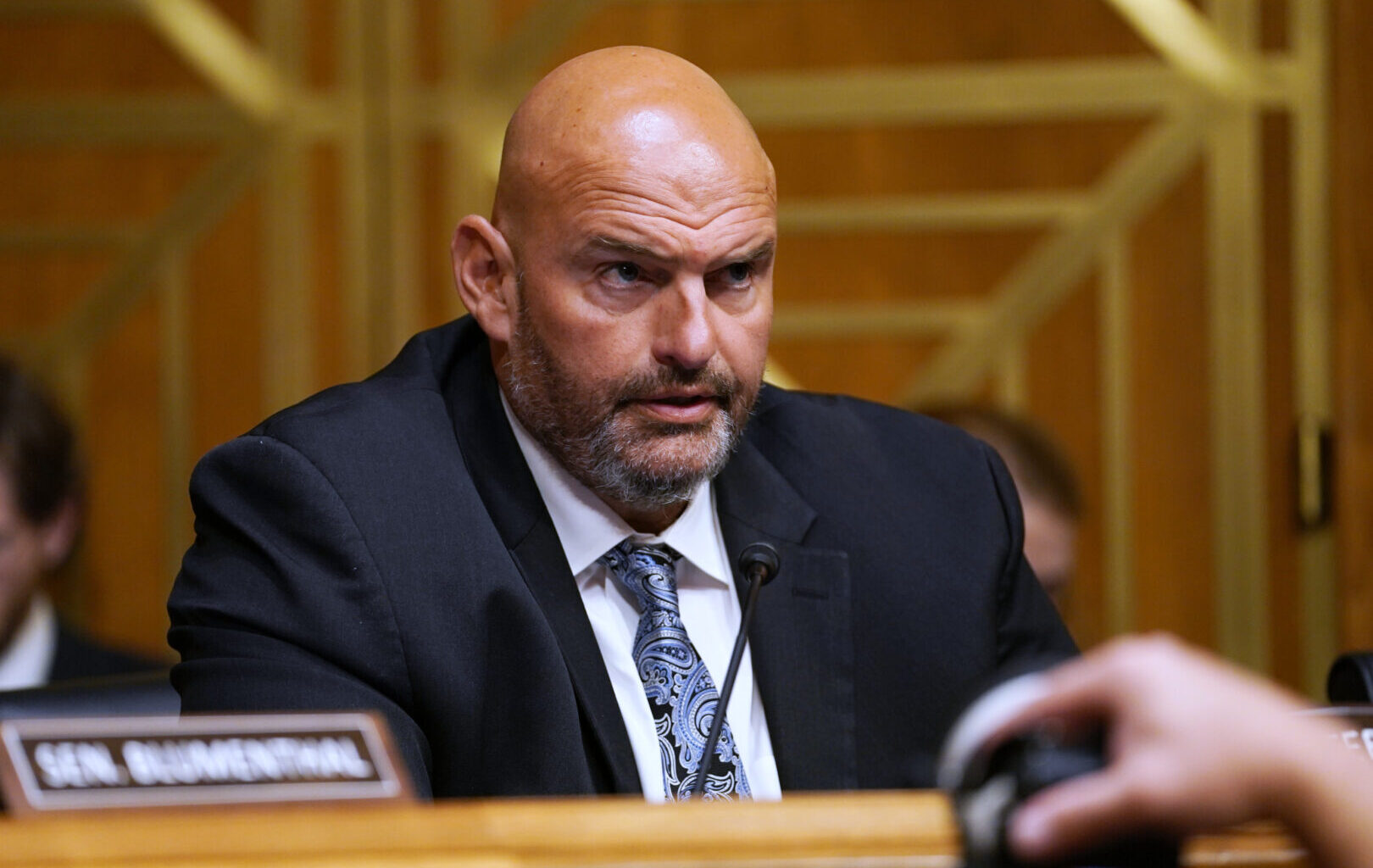 FILE - Sen. John Fetterman, D-Pa., speaks as Dr. Anthony Fauci appears before the Senate Homeland Security and Governmental Affairs Committee at the Capitol, July 29, 2026, in Washington. (AP Photo/Allison Robbert, File)