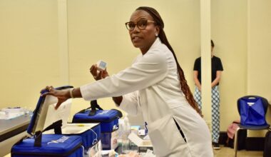 Dr. Ala Stanford, founder of the Black Doctors Consortium, speaks about a vaccines during a tour of a clinic Thursday, Aug. 27, 2026, at Benjamin Franklin High School.