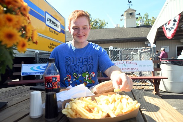 Lucas Daniels, 17, a senior at Fleetwood High School, digs into the French fries at the Oley Fair on Saturday, Sept. 19, 2026, at the Oley Fire Company Fairgrounds. (BILL UHRICH/READING EAGLE)