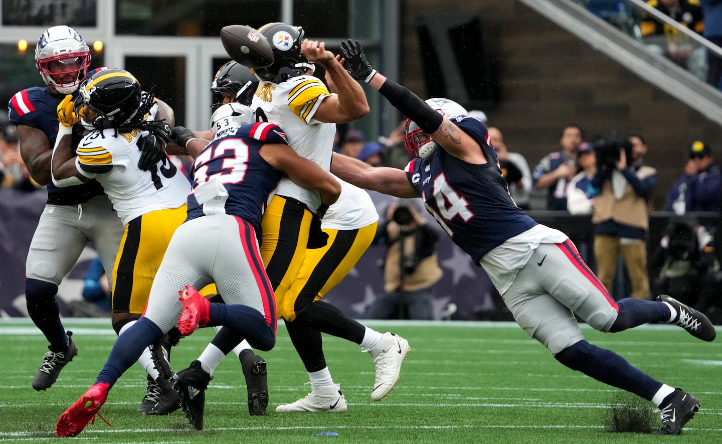 Christian Elliss crunched Aaron Rodgers, with Robert Spillane flying in just after Elliss forced the fumble.