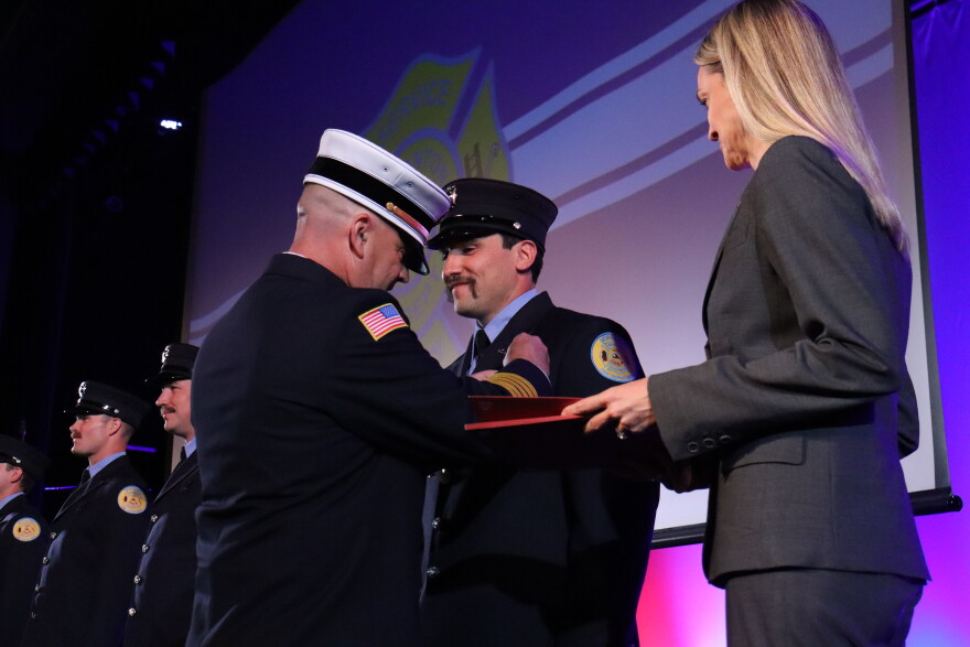 Scranton Fire Chief John Judge pins new Private Jarod Bernosky at a ceremony in June 2026.