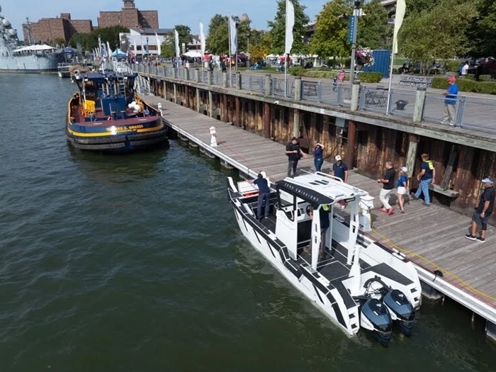 An electric workboat powered by Photon Marine outboards docked on the Erie Canal. [Photo: Photon Marine]