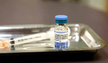 A vial of the measles, mumps, and rubella (MMR) vaccine is pictured at the International Community Health Services clinic ...