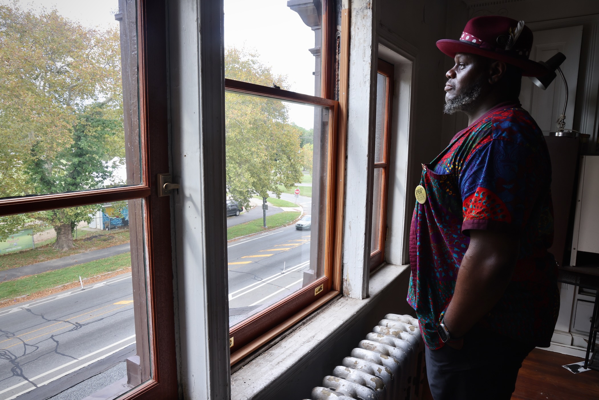 Anthony Tidd looks out a window in the John Coltrane house