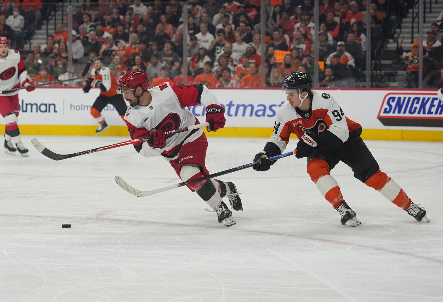 May 9, 2026; Philadelphia, Pennsylvania, USA; Carolina Hurricanes center Seth Jarvis (24) skates with the puck as Philadelphia Flyers right wing Porter Martone (94) defends during the first period in game four of the second round of the 2026 Stanely Cup Playoffs at Xfinity Mobile Arena.
