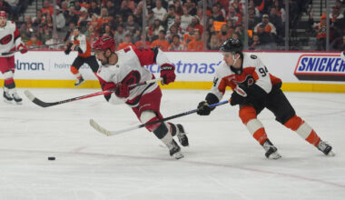 May 9, 2026; Philadelphia, Pennsylvania, USA; Carolina Hurricanes center Seth Jarvis (24) skates with the puck as Philadelphia Flyers right wing Porter Martone (94) defends during the first period in game four of the second round of the 2026 Stanely Cup Playoffs at Xfinity Mobile Arena.