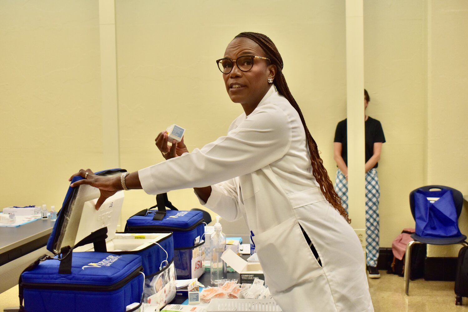 Dr. Ala Stanford, founder of the Black Doctors Consortium, speaks about a vaccines during a tour of a clinic Thursday, Aug. 27, 2026, at Benjamin Franklin High School.