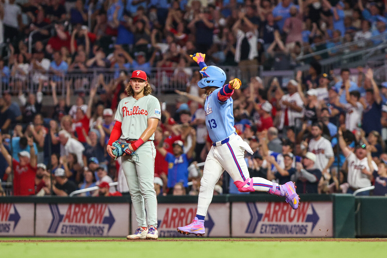 Atlanta Braves right fielder Ronald Acuna Jr. (13) celebrates hitting a home run against the Philadelphia Phillies during the fourth inning at Truist Park.