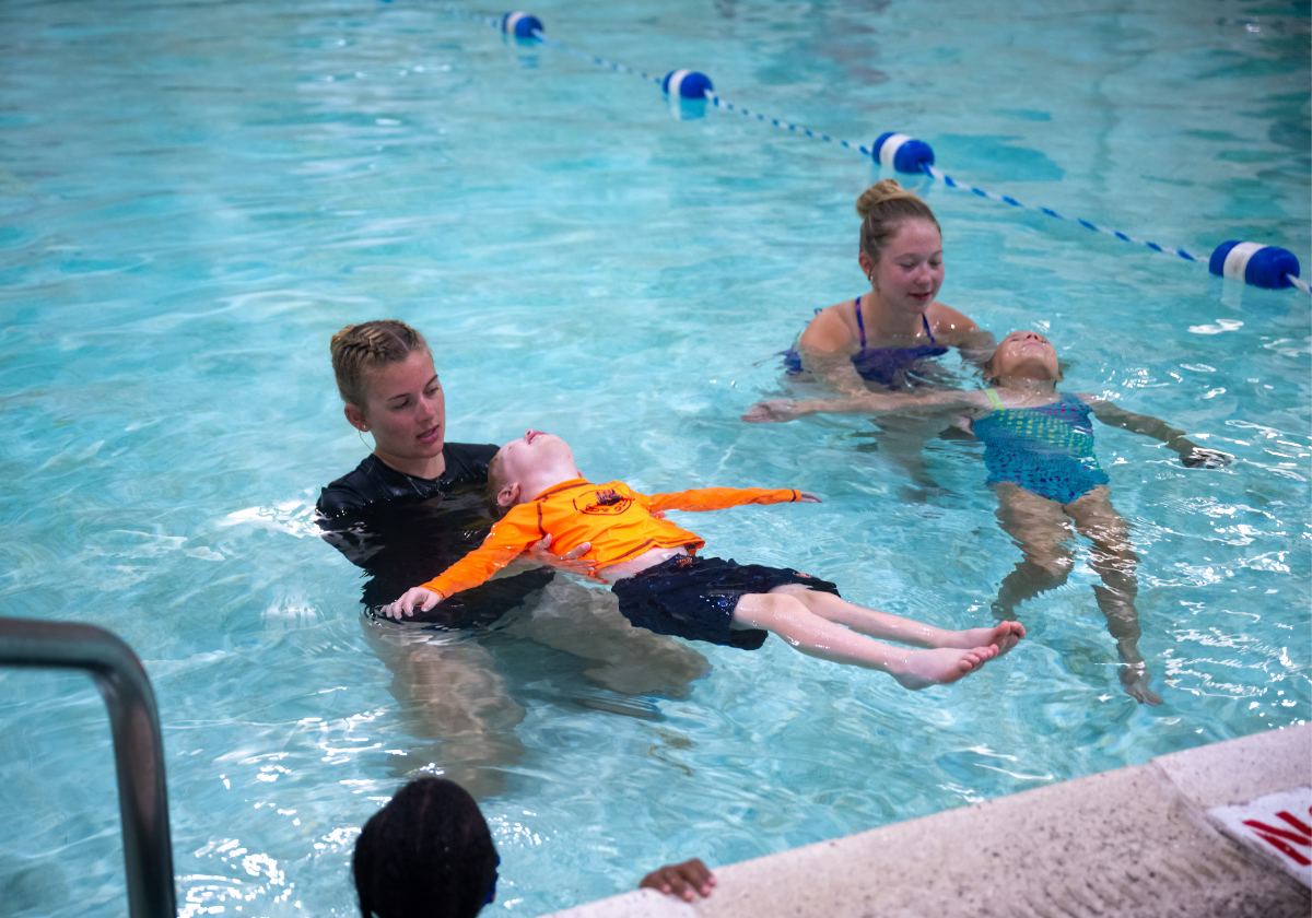 Parents and young children participate in a swim class at the YMCA of Greater Erie.