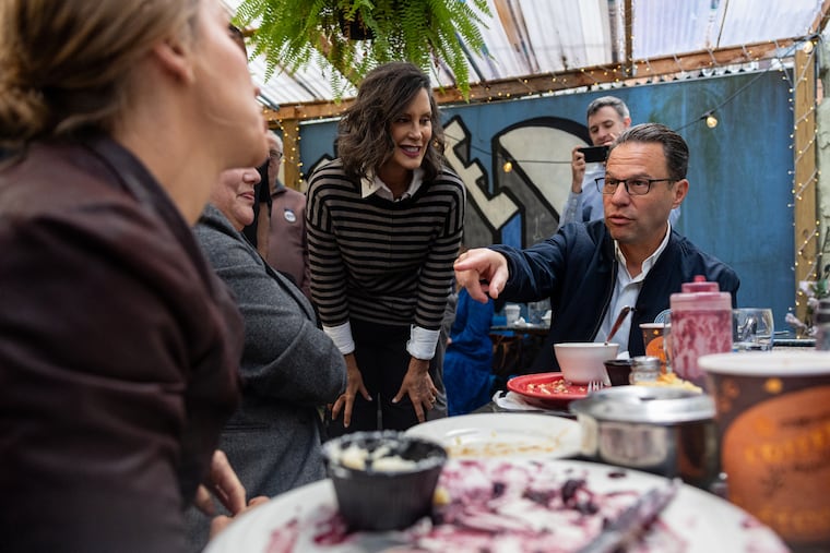 Gov. Josh Shapiro talks to patrons alongside Michigan Gov. Gretchen Whitmer out in the back patio of Sam’s Morning Glory Diner in South Philadelphia on Friday, Sept. 25, 2026. Shapiro is canvassing to get Pennsylvania Democrats elected up and down the ballot as the midterms are upcoming in November.