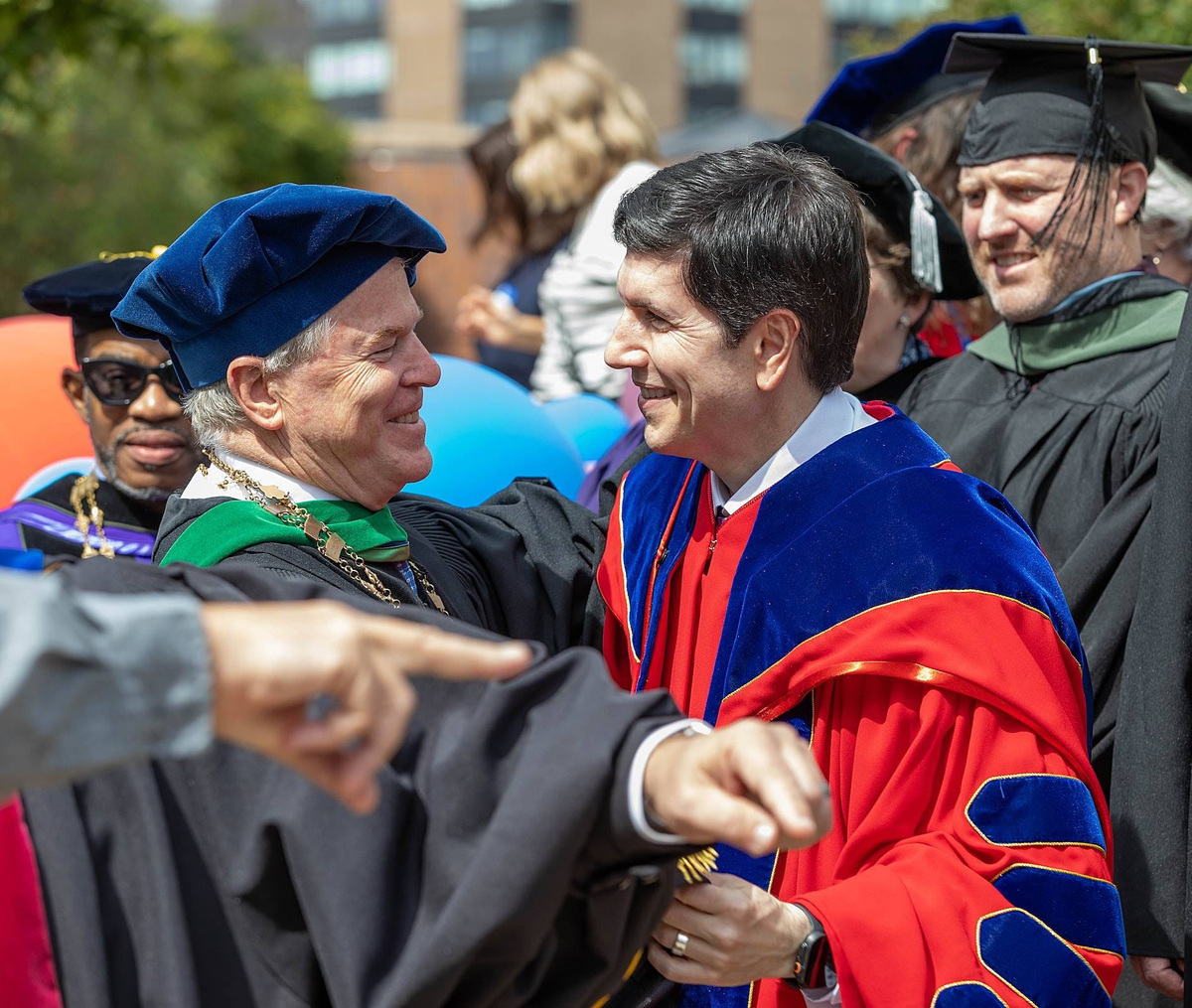 Duquesne University President David Dausey, right, embraces Mercyhurst University President David Livingston following Dausey's inauguration ceremony Sept. 17 at Duquesne. Dausey previously served as Mercyhurst provost.