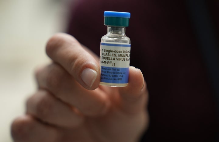FILE - Dr. Jessica Early holds a vial of the combination measles, mumps and rubella vaccine at Prisma Health Pediatrics in Greer, S.C., March 18, 2026. (AP Photo/Mary Conlon, File)