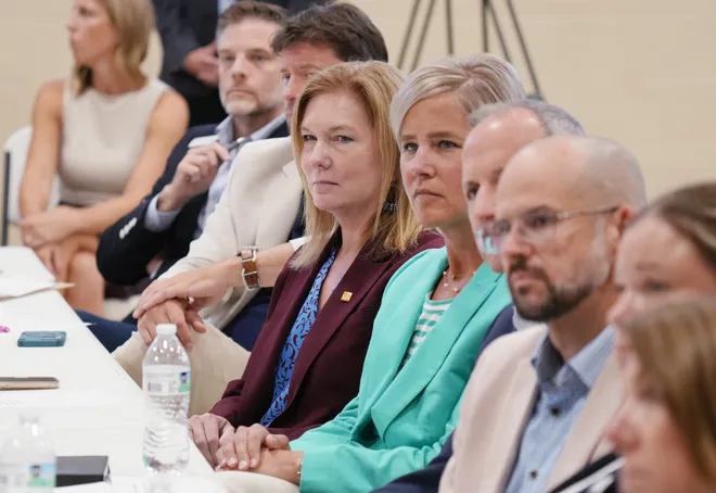 Community leaders listen as U.S. Senators John Fetterman and Dave McCormick join Erie Insurance CEO Tim NeCastro during a roundtable discussion dealing with housing, food insecurity and homelessness hosted at St. Paul's Neighborhood Center in Erie, Pa., on Aug. 28, 2026.