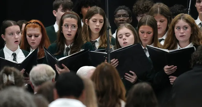 Mercyhurst Preparatory School choir members perform during a Centennial Mass inside the Mercyhurst Athletic Center in Erie, Pa., on Sept. 24, 2026. Mercyhurst College was founded by Mother Borgia Egan and the Sisters of Mercy in Erie, who trace their heritage to Dublin, Ireland. Mercyhurst opened to women in September of 1926.