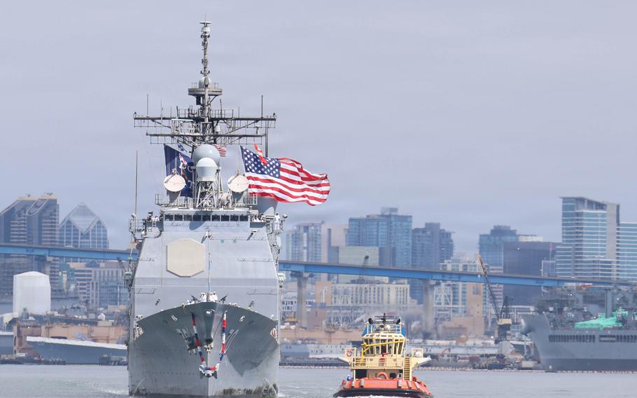 A Navy ship returns to port.