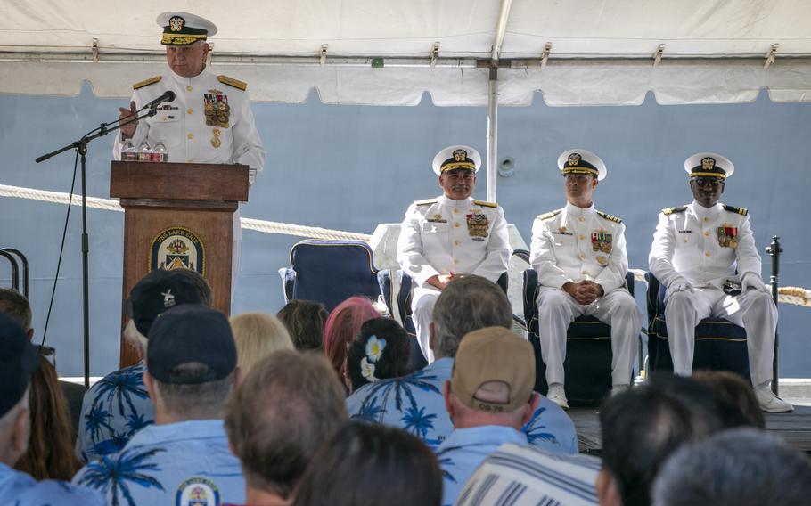 A sailor speaks to an audience.