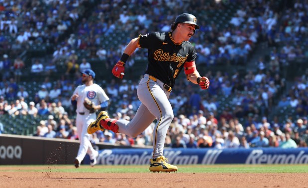 Pirates shortstop Konnor Griffin sprints to third base on a triple in the first inning against the Cubs on Sept. 11, 2026, at Wrigley Field. (Chris Sweda/Chicago Tribune)