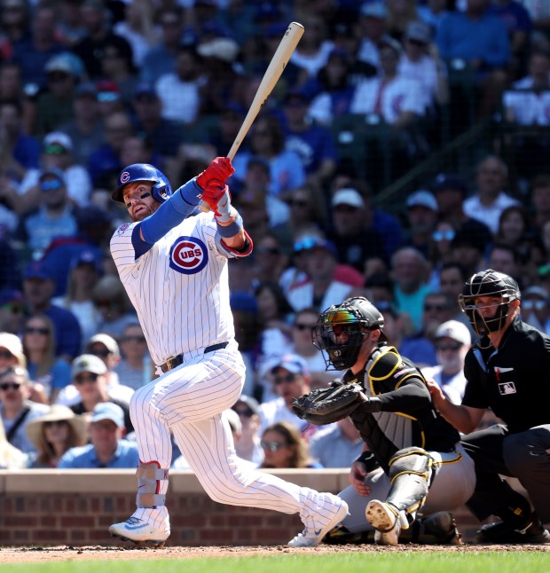Cubs catcher Carson Kelly hits a two-run double in the second inning against the Pirates on Sept. 11, 2026, at Wrigley Field. (Chris Sweda/Chicago Tribune)