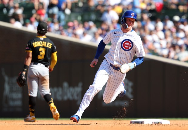 Cubs center fielder Pete Crow-Armstrong advances to third base on a run-scoring single by Seiya Suzuki in the fourth inning against the Pirates on Sept. 11, 2026, at Wrigley Field. (Chris Sweda/Chicago Tribune)