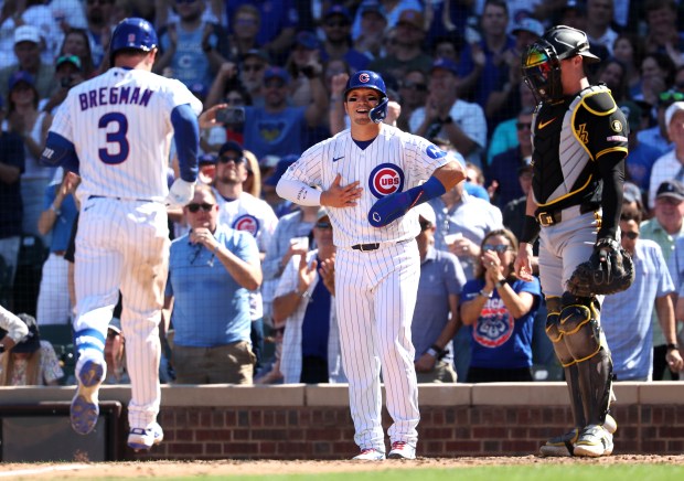 Cubs right fielder Seiya Suzuki, center, starts to celebrate at the plate after Alex Bregman's two-run home run in the fourth inning against the Pirates on Sept. 11, 2026, at Wrigley Field. (Chris Sweda/Chicago Tribune)