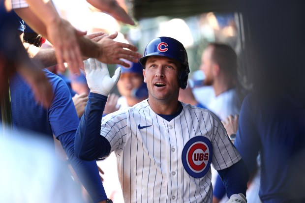 Cubs third baseman Alex Bregman high-fives teammates in the dugout after hitting a two-run home run in the fourth inning against the Pirates on Sept. 11, 2026, at Wrigley Field. (Chris Sweda/Chicago Tribune)