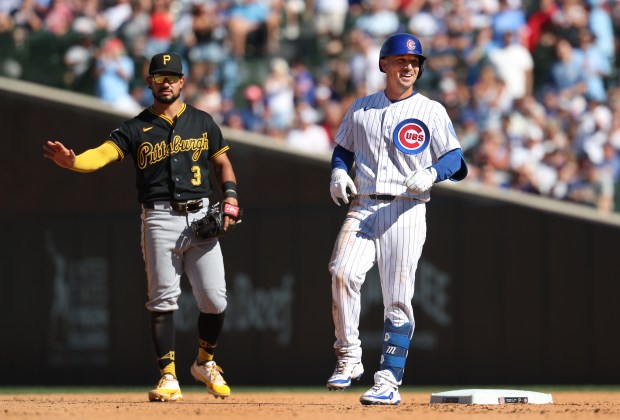 Chicago Cubs third baseman Alex Bregman (3) flashes a smile at second base after his double in the sixth inning of a game against second baseman Nick Gonzales (3) and the Pittsburgh Pirates at Wrigley Field in Chicago on Sept. 11, 2026. (Chris Sweda/Chicago Tribune)