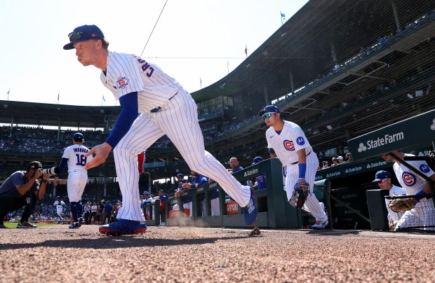 Cubs center fielder Pete Crow-Armstrong (4) and his teammates take the field at the start of a game against the Pirates on Friday, Sept. 11, 2026, at Wrigley Field. (Chris Sweda/Chicago Tribune)