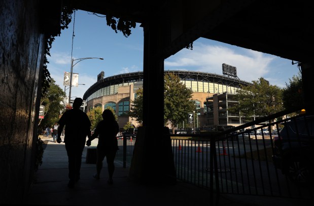 Baseball fans walk underneath a set of train tracks at 35th Street before a game between the Chicago White Sox and the Pittsburgh Pirates at Rate Field in Chicago on Sept. 8, 2026. (Chris Sweda/Chicago Tribune)