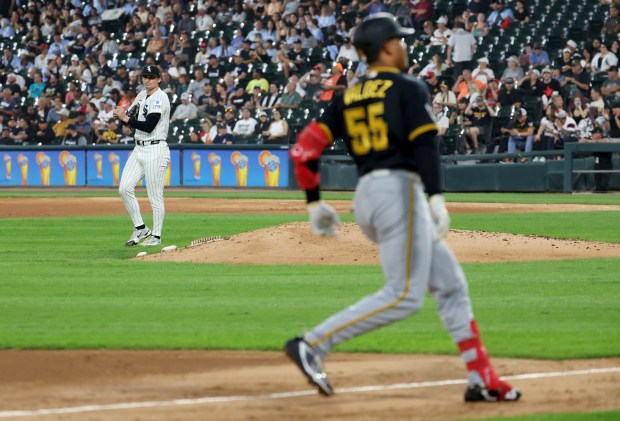 Chicago White Sox starting pitcher Davis Martin stands on the infield as Pittsburgh Pirates right fielder Esmerlyn Valdez (55) rounds the bases after hitting a solo home run in the fifth inning of a game at Rate Field in Chicago on Sept. 9, 2026. (Chris Sweda/Chicago Tribune)
