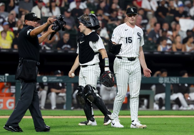 Chicago White Sox catcher Kyle Teel and relief pitcher Sean Newcomb stand on the field after a bunt single by Pittsburgh Pirates first baseman Spencer Horwitz in the seventh inning of a game at Rate Field in Chicago on Sept. 9, 2026. (Chris Sweda/Chicago Tribune)