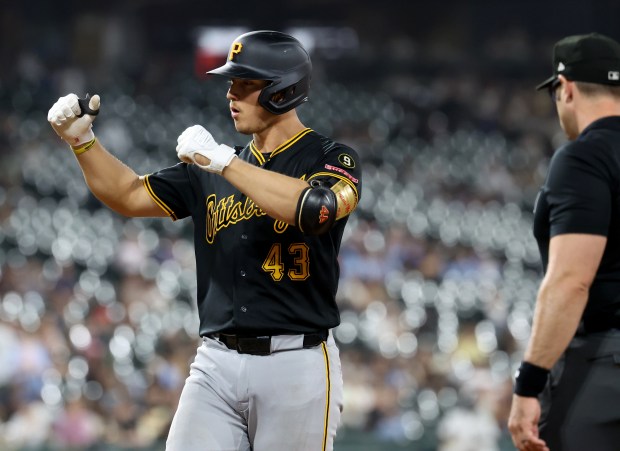 Pittsburgh Pirates catcher Rafael Flores Jr. (43) celebrates at first base after driving in a run on a single in the seventh inning of a game against the Chicago White Sox at Rate Field in Chicago on Sept. 9, 2026. (Chris Sweda/Chicago Tribune)