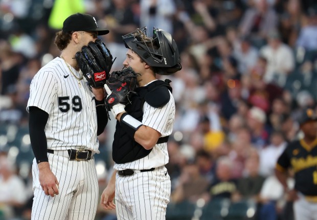 Chicago White Sox starting pitcher Sean Burke (59) and catcher Kyle Teel chat on the mound in the first inning of a game against the Pittsburgh Pirates at Rate Field in Chicago on Sept. 8, 2026. (Chris Sweda/Chicago Tribune)