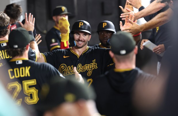 Pittsburgh Pirates first baseman Spencer Horwitz (2) is congratulated by his teammates in the dugout after scoring on a two-run single by Konnor Griffin in the seventh inning of a game against the Chicago White Sox at Rate Field in Chicago on Sept. 9, 2026. (Chris Sweda/Chicago Tribune)