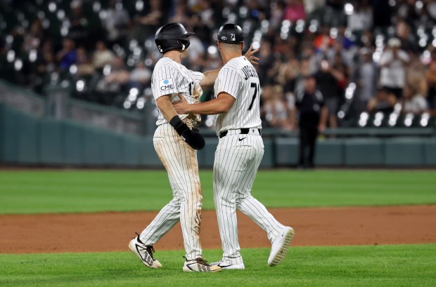Chicago White Sox second baseman Sam Antonacci (left) is held back by third base/infield coach Justin Jirschele (right) as tempers flare between the Sox and the Pittsburgh Pirates at the end of the seventh inning of a game at Rate Field in Chicago on Sept. 9, 2026. (Chris Sweda/Chicago Tribune)