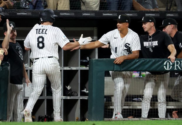 Chicago White Sox catcher Kyle Teel (8) is congratulated by manager Will Venable after Teel hit a solo home run in the sixth inning of a game against the Pittsburgh Pirates at Rate Field in Chicago on Sept. 8, 2026. (Chris Sweda/Chicago Tribune)