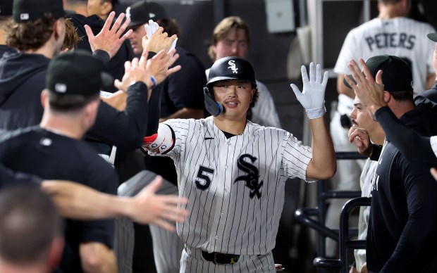 Chicago White Sox first baseman Munetaka Murakami (5) is congratulated by his teammates in the dugout after hitting a solo home run in the eighth inning of a game against the Pittsburgh Pirates at Rate Field in Chicago on Sept. 9, 2026. (Chris Sweda/Chicago Tribune)