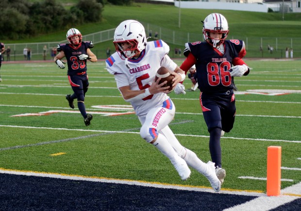 Carbondale Area running back Caedon Voglino (5) scores a touchdown against Nanticoke Area at Frank Chicknoski Stadium in Nanticoke on Friday, Aug. 28, 2026. BILL TARUTIS / CONTRIBUTING PHOTOGRAPHER