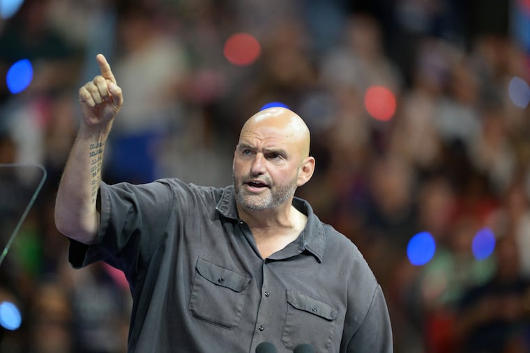 Sen. John Fetterman speaks at a Democratic campaign event with Vice President Kamala Harris and Minnesota Gov. Tim Walz at Temple University's Liacouras Center on Aug. 6, 2024.