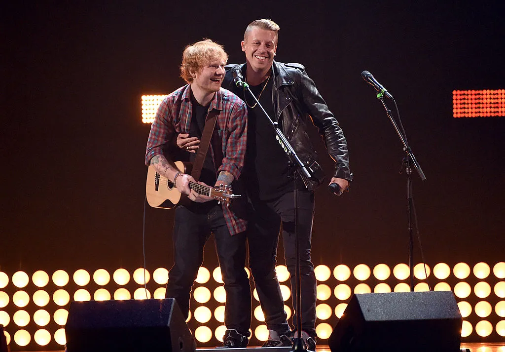 Singer/songwriter Ed Sheeran (L) and rapper Macklemore perform onstage during the 2014 iHeartRadio Music Festival at the MGM Grand Garden Arena on September 20, 2014 in Las Vegas, Nevada. (Photo by Ethan Miller/Getty Images for iHeartMedia)