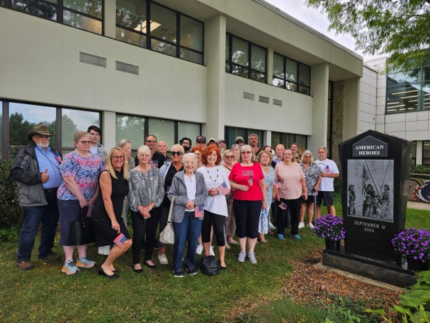 More than 40 gathered Friday around a black granite monument on the Penn State Berks campus to reflect on the terrorist attacks, the victims and those who responded 25 years ago.(MICHELLE LYNCH/READING EAGLE)