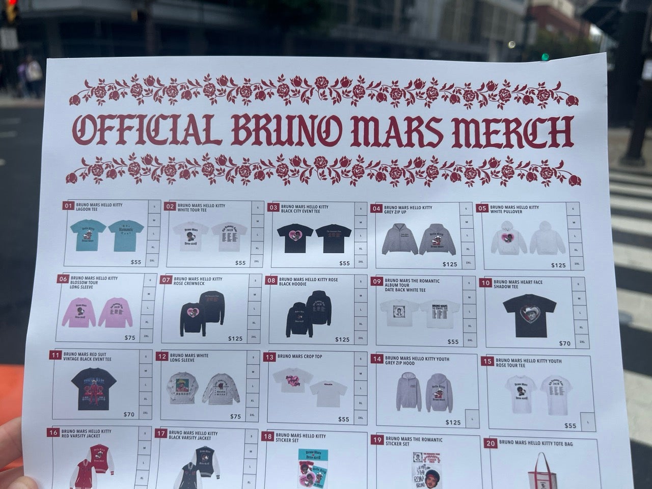 A poster featuring photos of all of the merch for sale at the Bruno Mars and Hello Kitty pop-up merch shop.