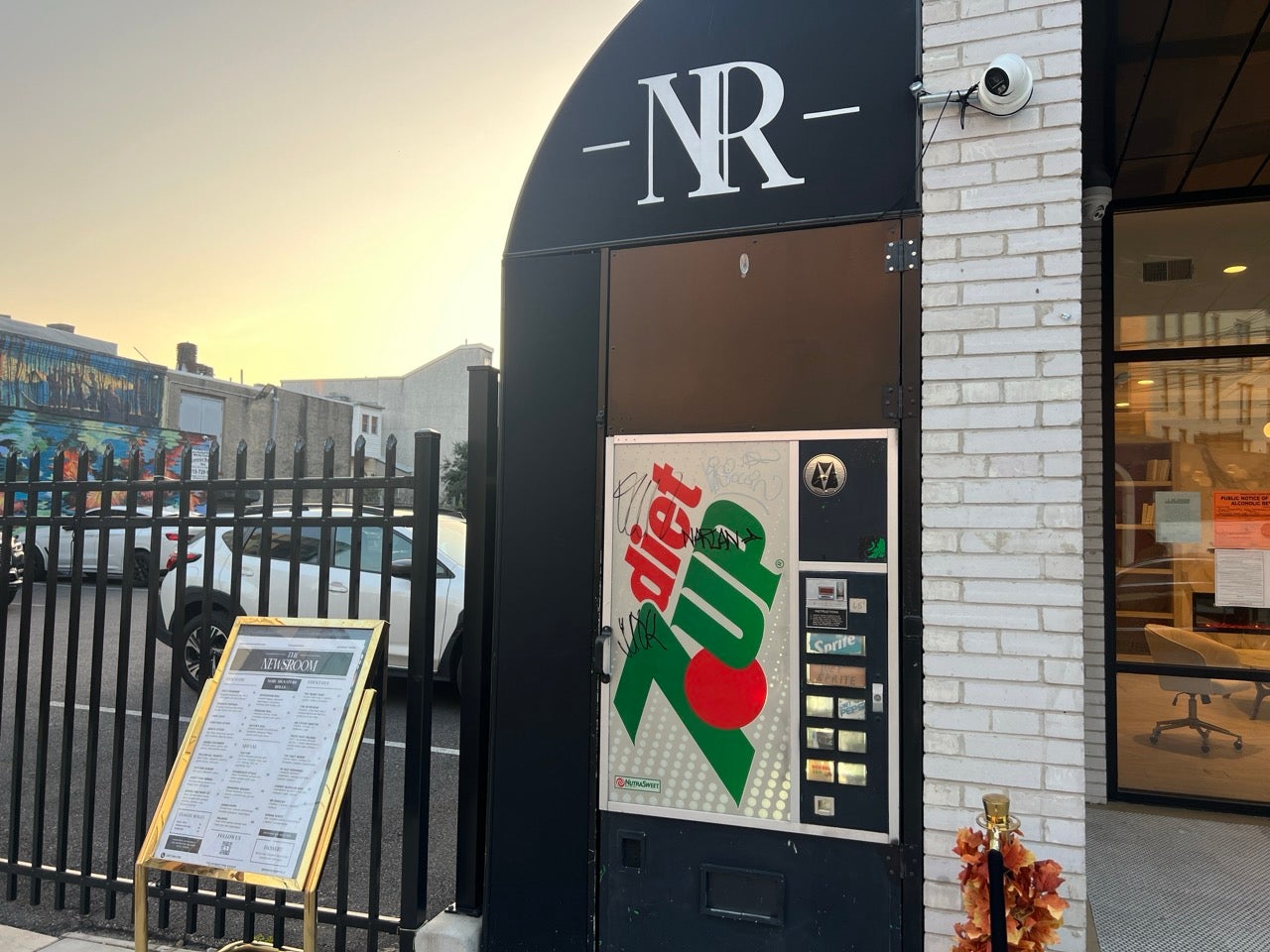 The Newsroom Philadelphia is a speakeasy set up behind a non descript retro diet 7UP sign. Here is the sign, which is the secret door to the restaurant. NR is up above it, for Newsroom.