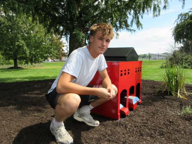 North Montco Technical Career Center junior Matt Tomczak poses next to a firehouse and emergency vehicles he welded to pay tribute to emergency responders at the school's September 11th memorial garden on Thursday, Sept. 10, 2026. (Dan Sokil - MediaNews Group)