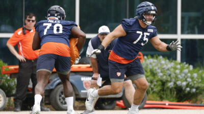 Jun 3, 2025; Lake Forest, IL, USA; Chicago Bears offensive tackle Ozzy Trapilo (75) runs on the field during minicamp at Halas Hall.