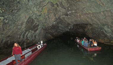People  begin their boat tour of Penn's Cave on Aug. 9, 2026, in Gregg Township, Centre County, Pa., near Centre Hall, Pa.  Penn's Cave is an all-water cavern, a historic 1,300-foot limestone show cave with tours by boat, which opened as a commercial show cave in 1885 and was listed on the National Register of Historic Places in 1976. The site also includes the 1,400 acres of preserved land of a farm-nature-wildlife park bus tour which featuring bison, longhorn cattle, red and silver foxes, black bears, elk, whitetail deer, wild burros, mountain lions, and wolves. The Pennsylvania Department of Conservation and Natural Resources has proposals to acquire and maintain the property.