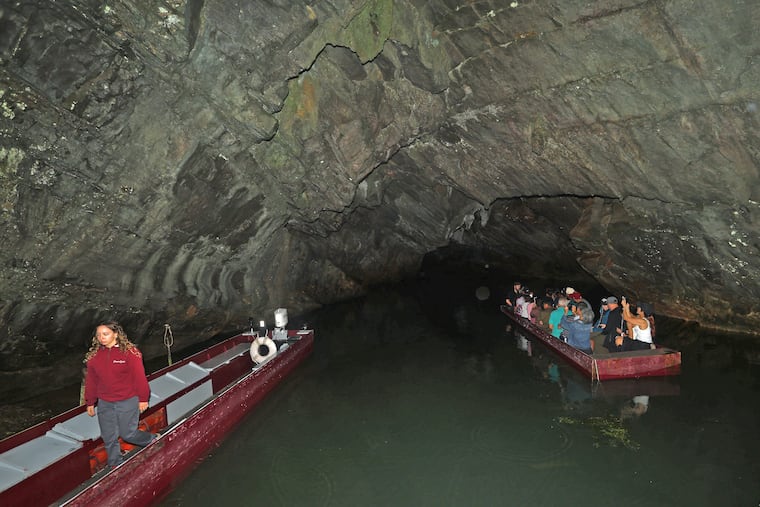 People  begin their boat tour of Penn's Cave on Aug. 9, 2026, in Gregg Township, Centre County, Pa., near Centre Hall, Pa.  Penn's Cave is an all-water cavern, a historic 1,300-foot limestone show cave with tours by boat, which opened as a commercial show cave in 1885 and was listed on the National Register of Historic Places in 1976. The site also includes the 1,400 acres of preserved land of a farm-nature-wildlife park bus tour which featuring bison, longhorn cattle, red and silver foxes, black bears, elk, whitetail deer, wild burros, mountain lions, and wolves. The Pennsylvania Department of Conservation and Natural Resources has proposals to acquire and maintain the property.