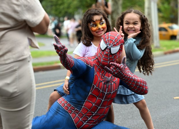 Kids get their pictures taken with Spiderman during the Berks Latin Fest in Reading City Park on Saturday, Sept. 12, 2026.   (BILL UHRICH/READING EAGLE)